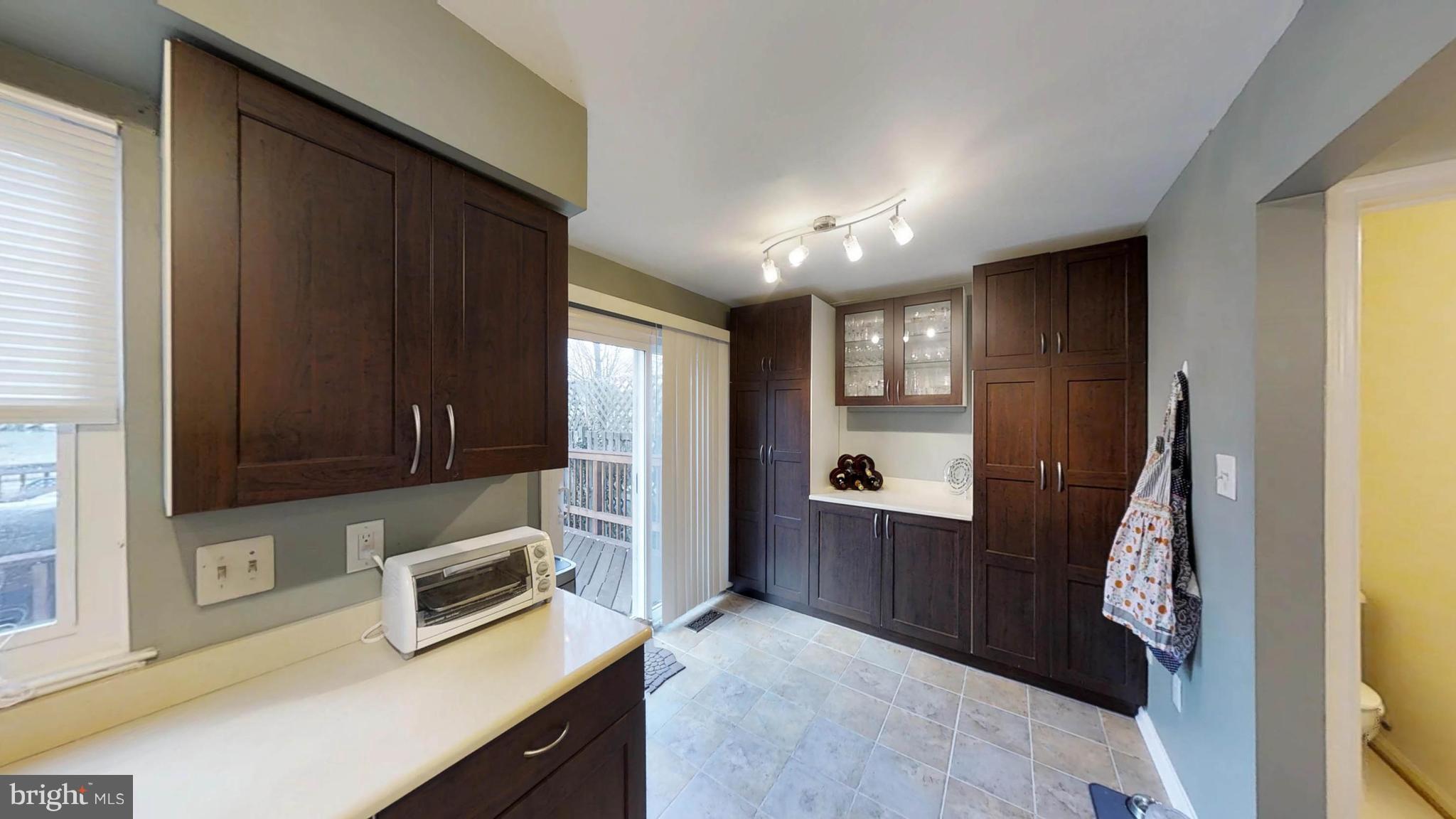 14924 Habersham Circle Silver Spring, MD 20906 - Photo 16 of 27 a view of kitchen with cabinets and wooden floor