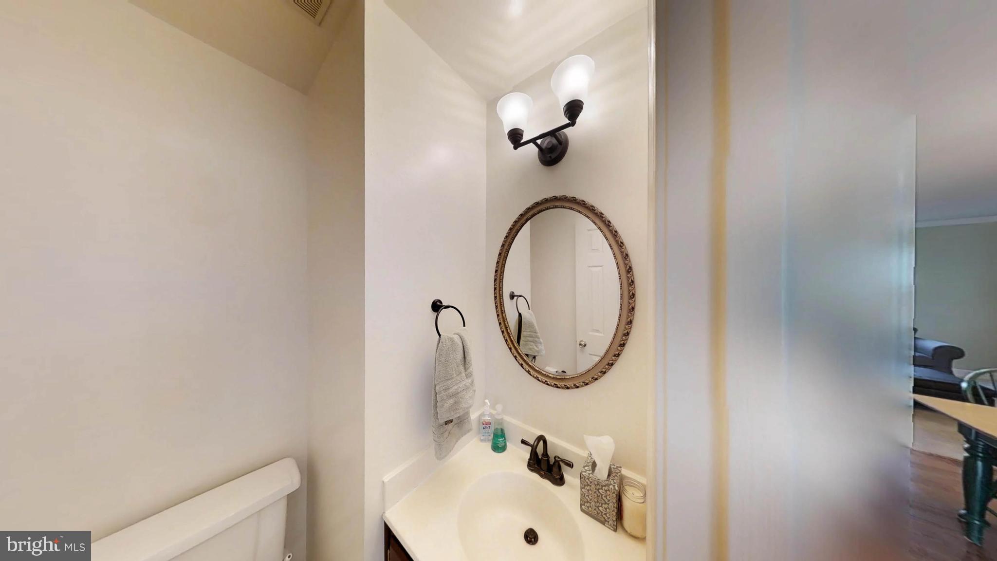 14924 Habersham Circle Silver Spring, MD 20906 - Photo 18 of 27 a bathroom with a sink and a mirror