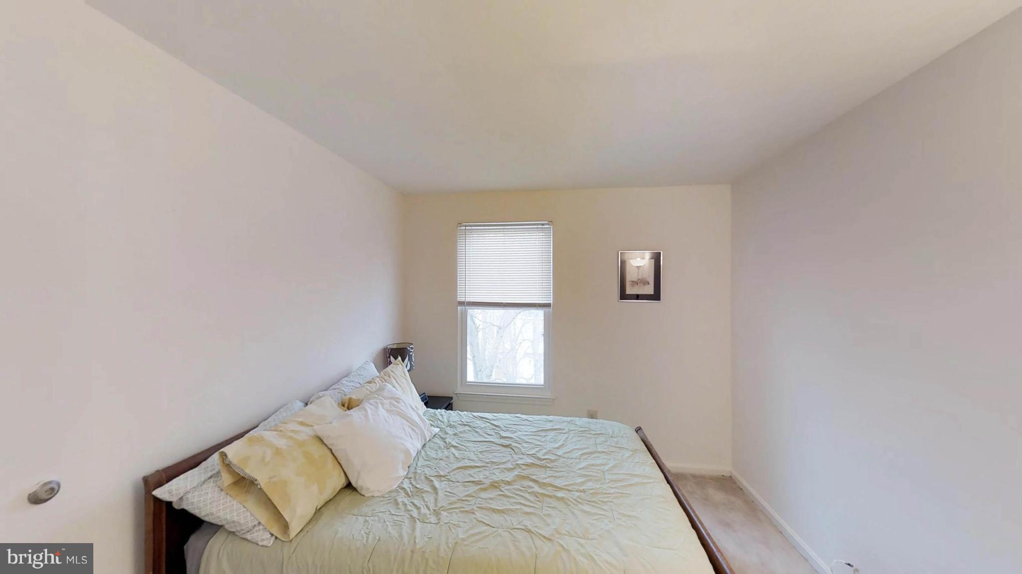 14924 Habersham Circle Silver Spring, MD 20906 - Photo 23 of 27 a bedroom with a bed and a window