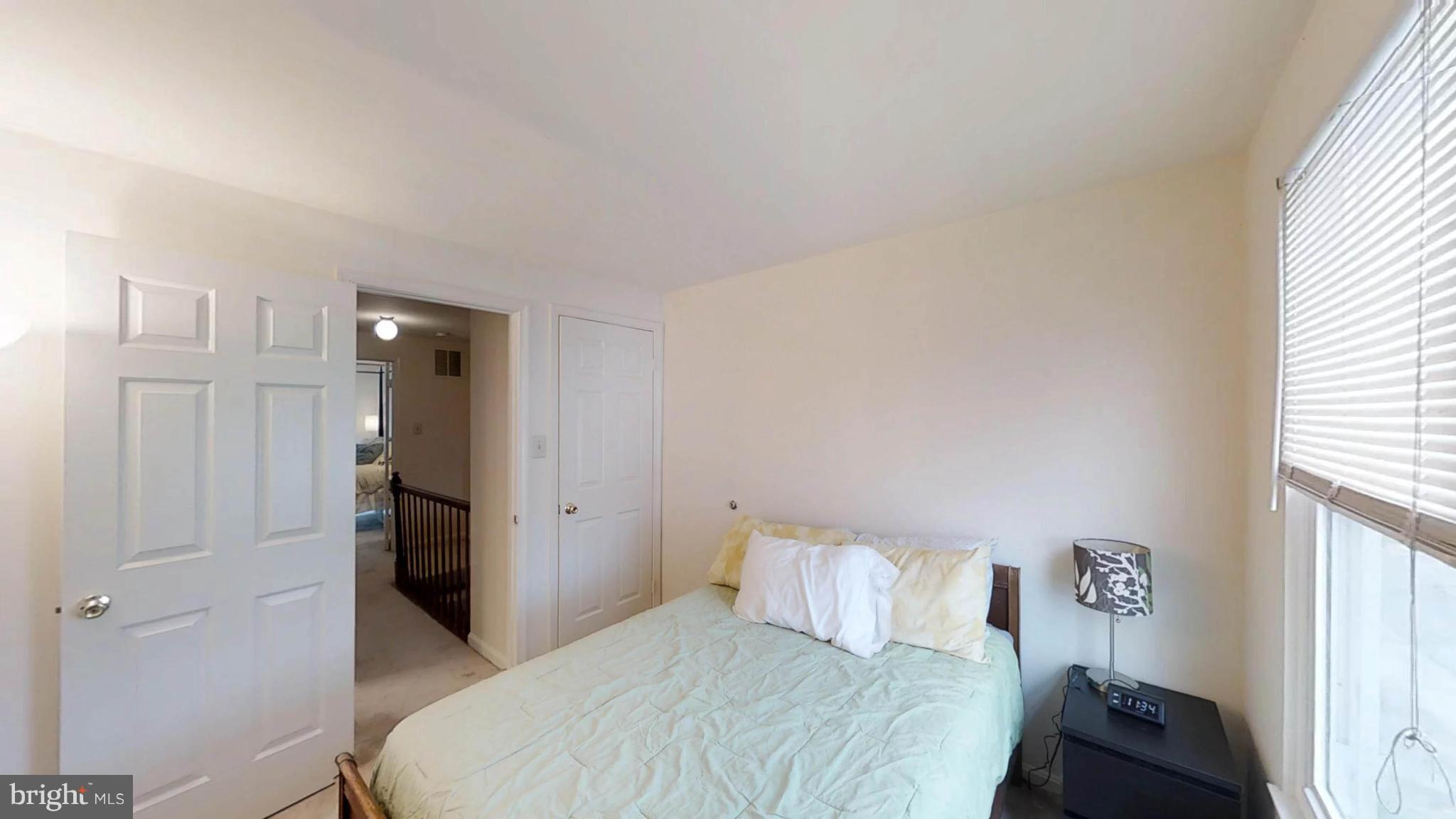 14924 Habersham Circle Silver Spring, MD 20906 - Photo 24 of 27 a bedroom with a bed and a window