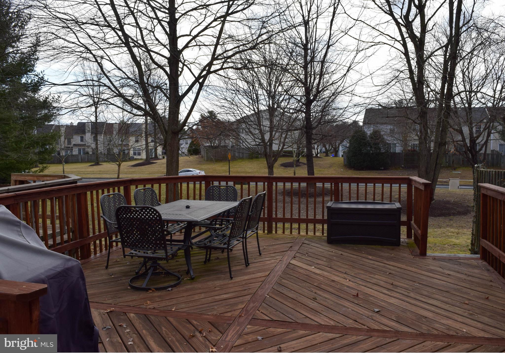14924 Habersham Circle Silver Spring, MD 20906 - Photo 27 of 27 a view of a roof deck with table and chairs and wooden floor