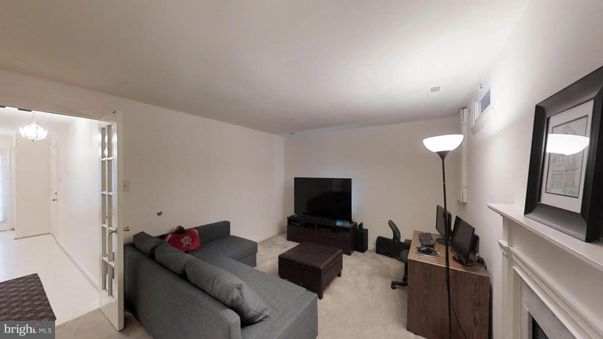 14924 Habersham Circle Silver Spring, MD 20906 - Photo 4 of 27 a living room with furniture and a flat screen tv