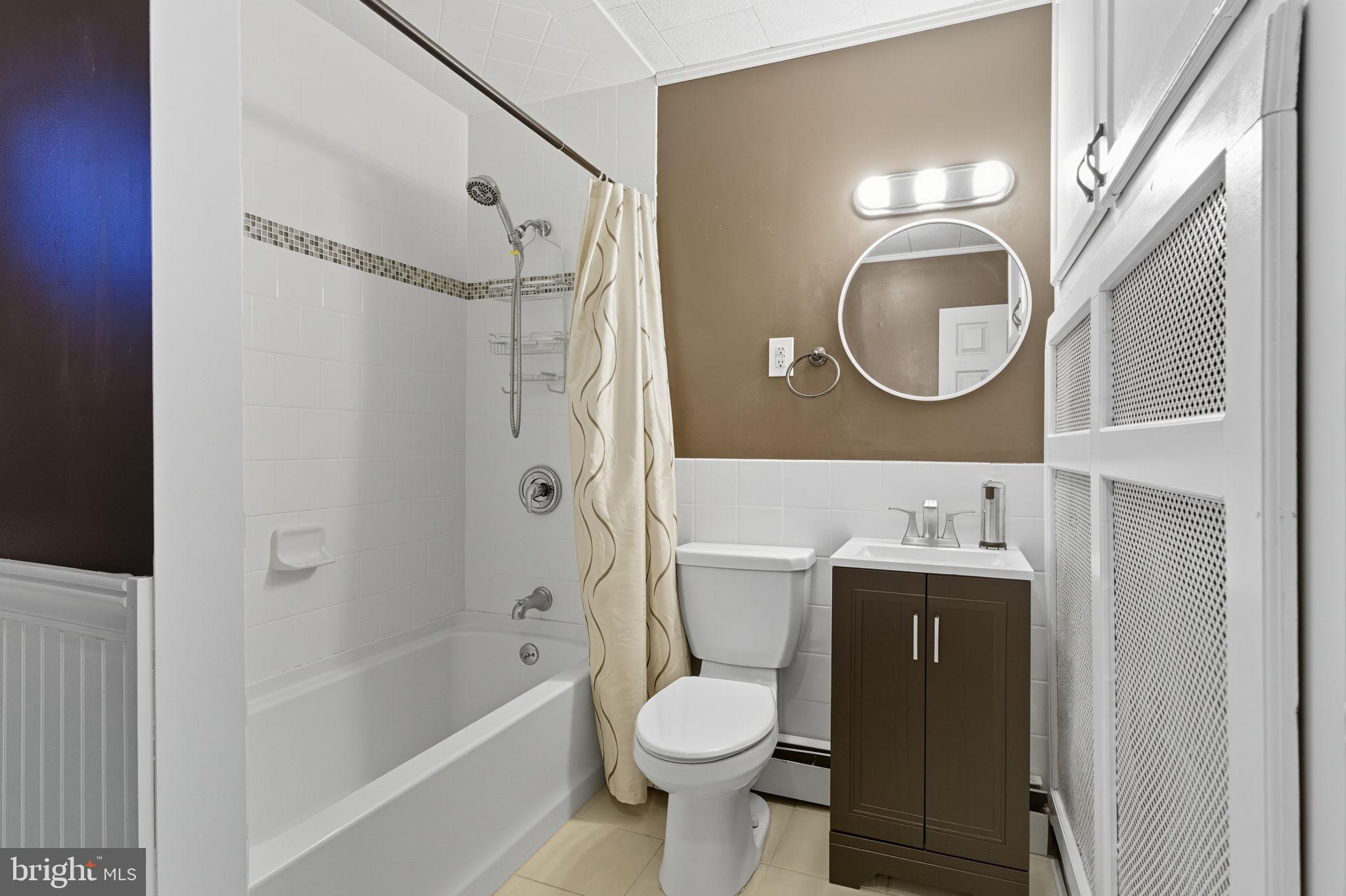 9 Newberry Lane Levittown, PA 19054 - Photo 12 of 36 a bathroom with a toilet a sink and a bathtub
