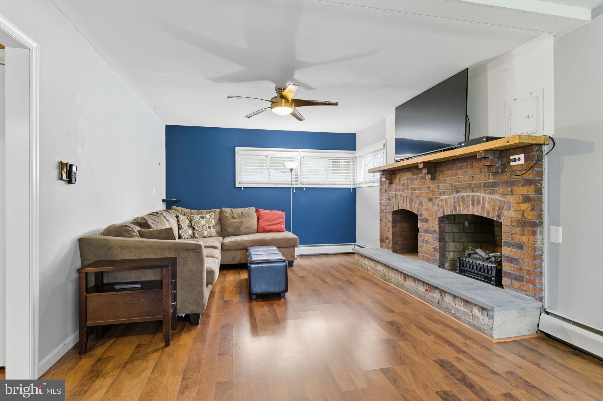 9 Newberry Lane Levittown, PA 19054 - Photo 14 of 36 a living room with furniture and a fireplace