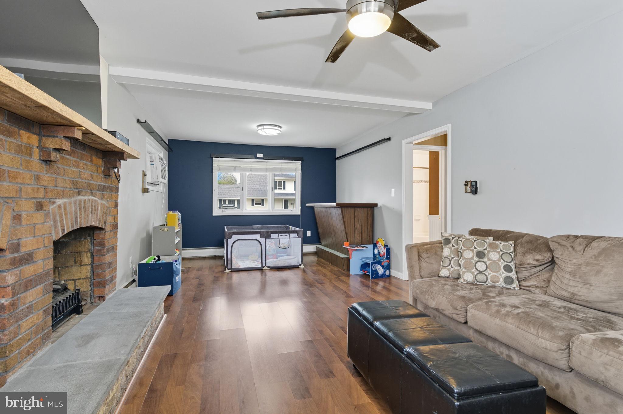9 Newberry Lane Levittown, PA 19054 - Photo 15 of 36 a living room with furniture and a fireplace