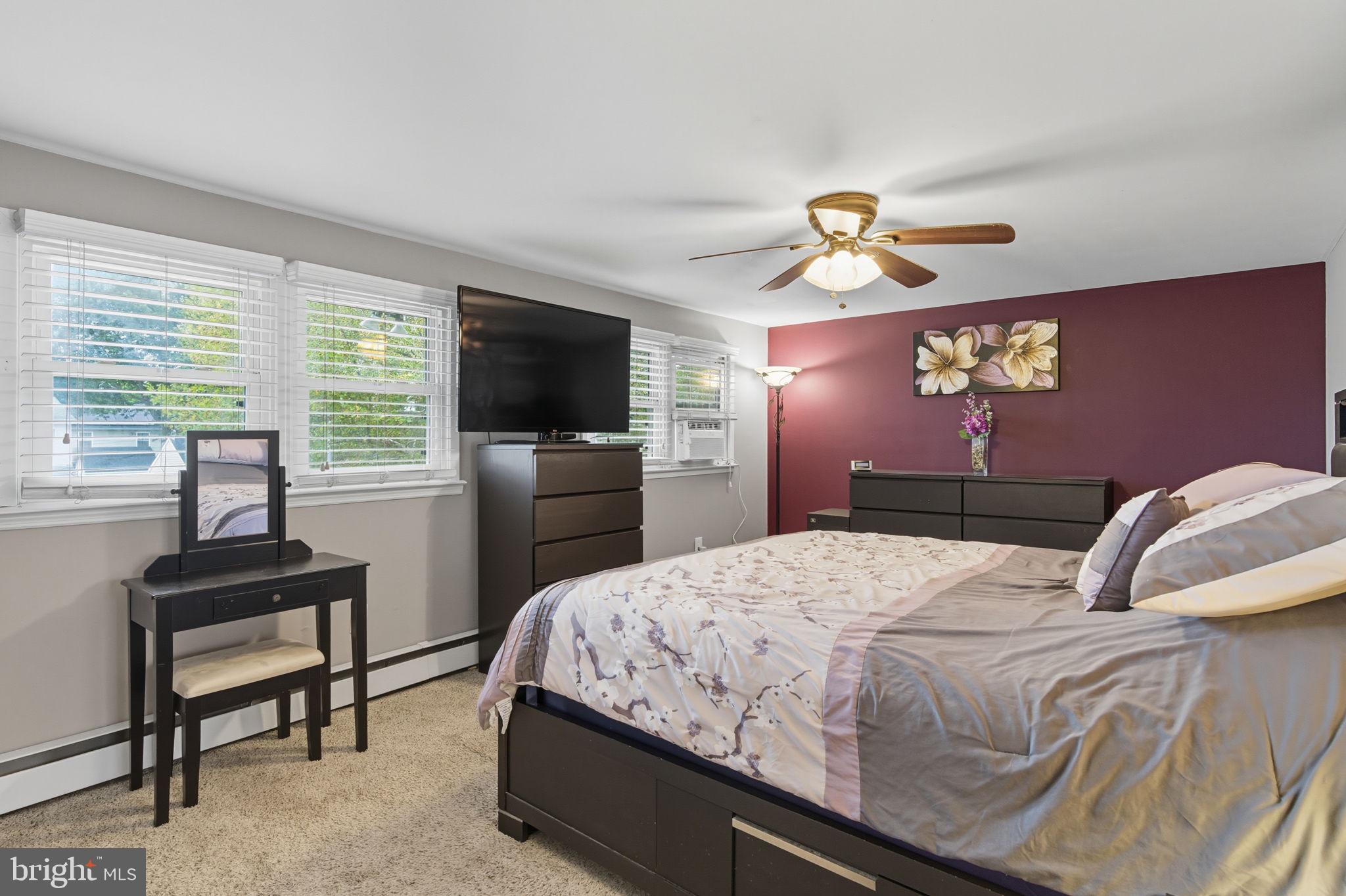 9 Newberry Lane Levittown, PA 19054 - Photo 17 of 36 a bedroom with a bed and a flat screen tv
