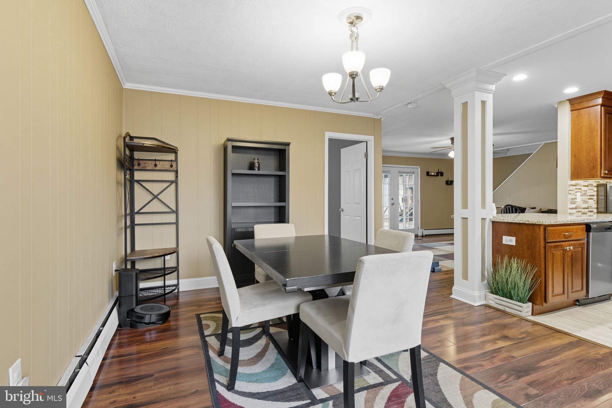 9 Newberry Lane Levittown, PA 19054 - Photo 2 of 36 a view of a dining room with furniture and wooden floor