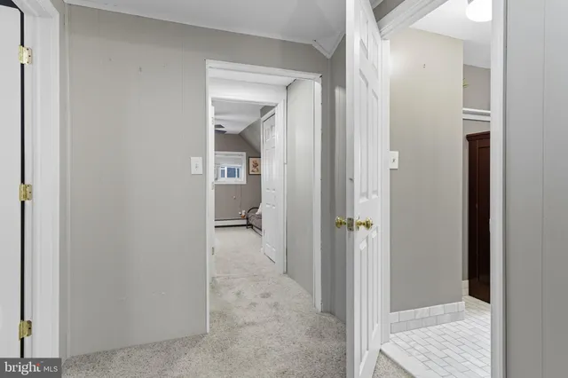 a view of a bathroom from a hallway