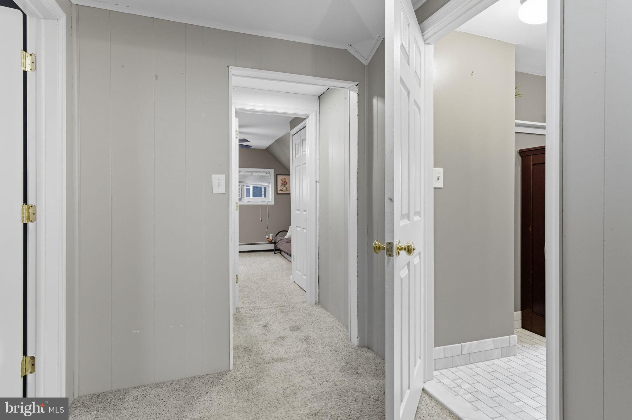 9 Newberry Lane Levittown, PA 19054 - Photo 21 of 36 a view of a bathroom from a hallway