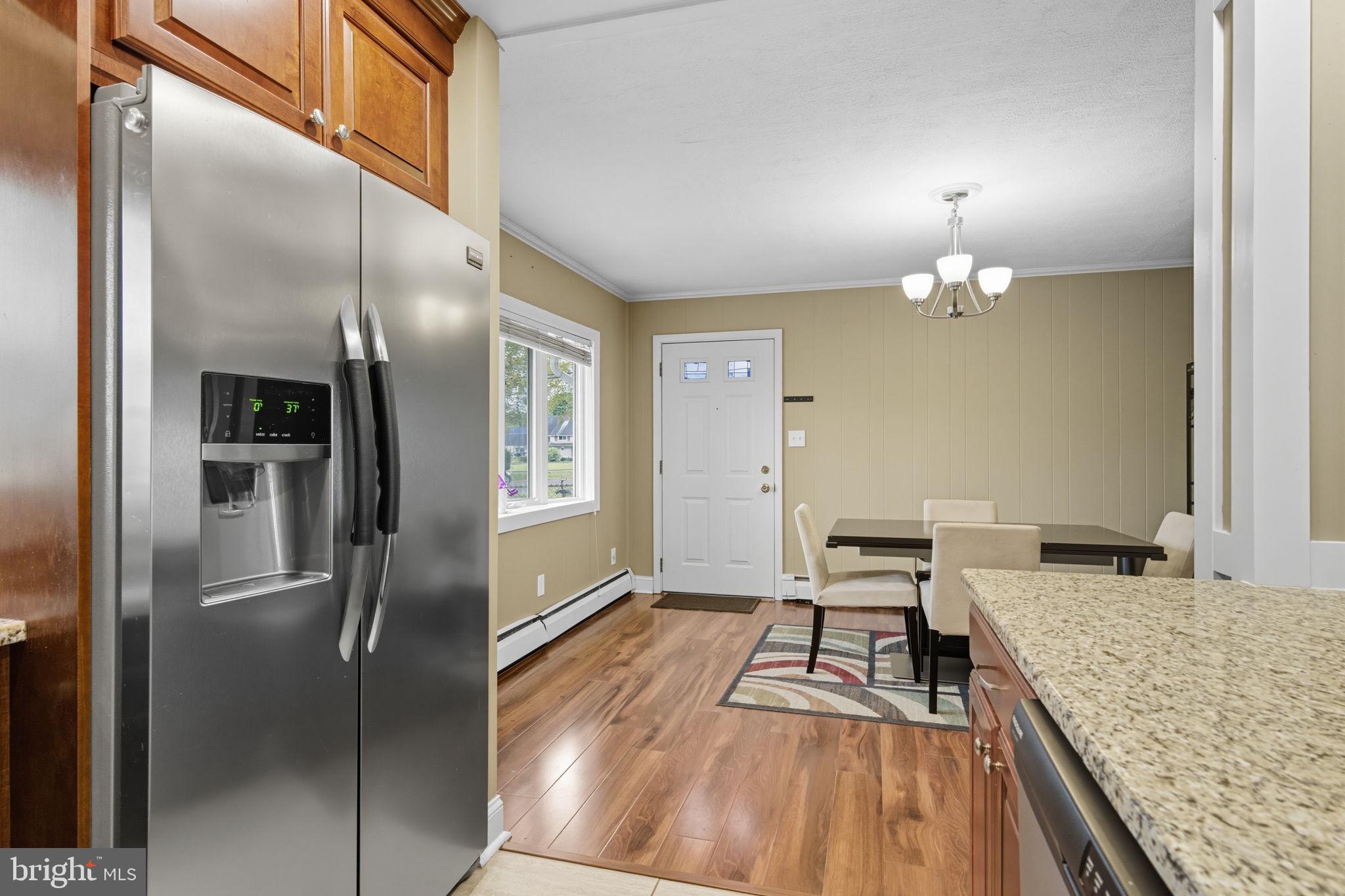 9 Newberry Lane Levittown, PA 19054 - Photo 7 of 36 a kitchen with granite countertop a refrigerator and a stove