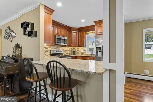 a view of hall way with furniture and entryway