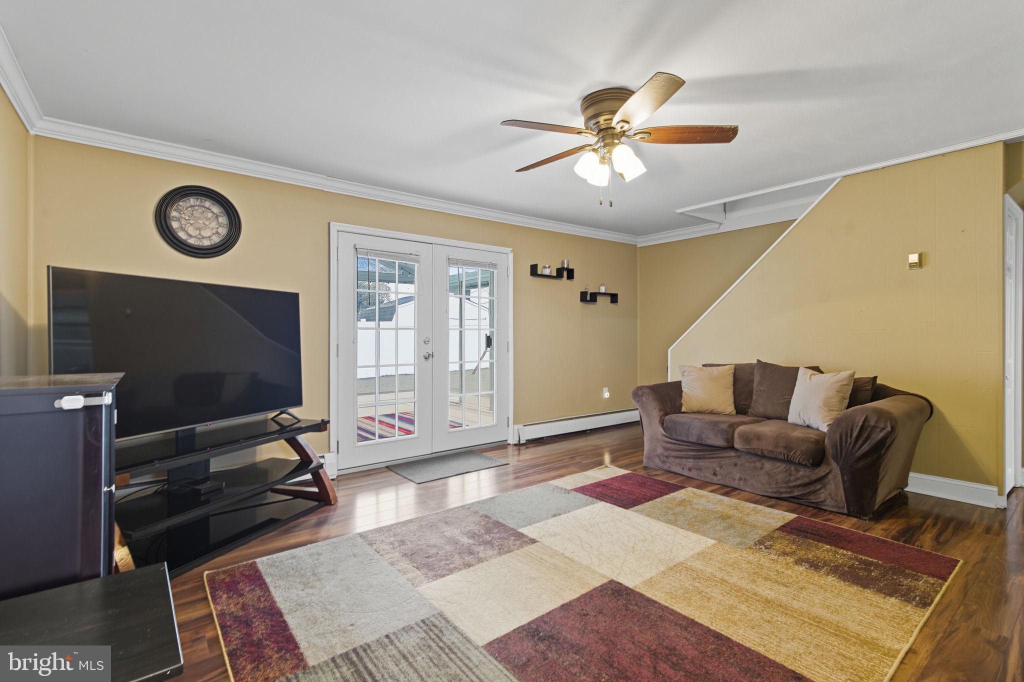9 Newberry Lane Levittown, PA 19054 - Photo 10 of 36 a living room with furniture and a flat screen tv