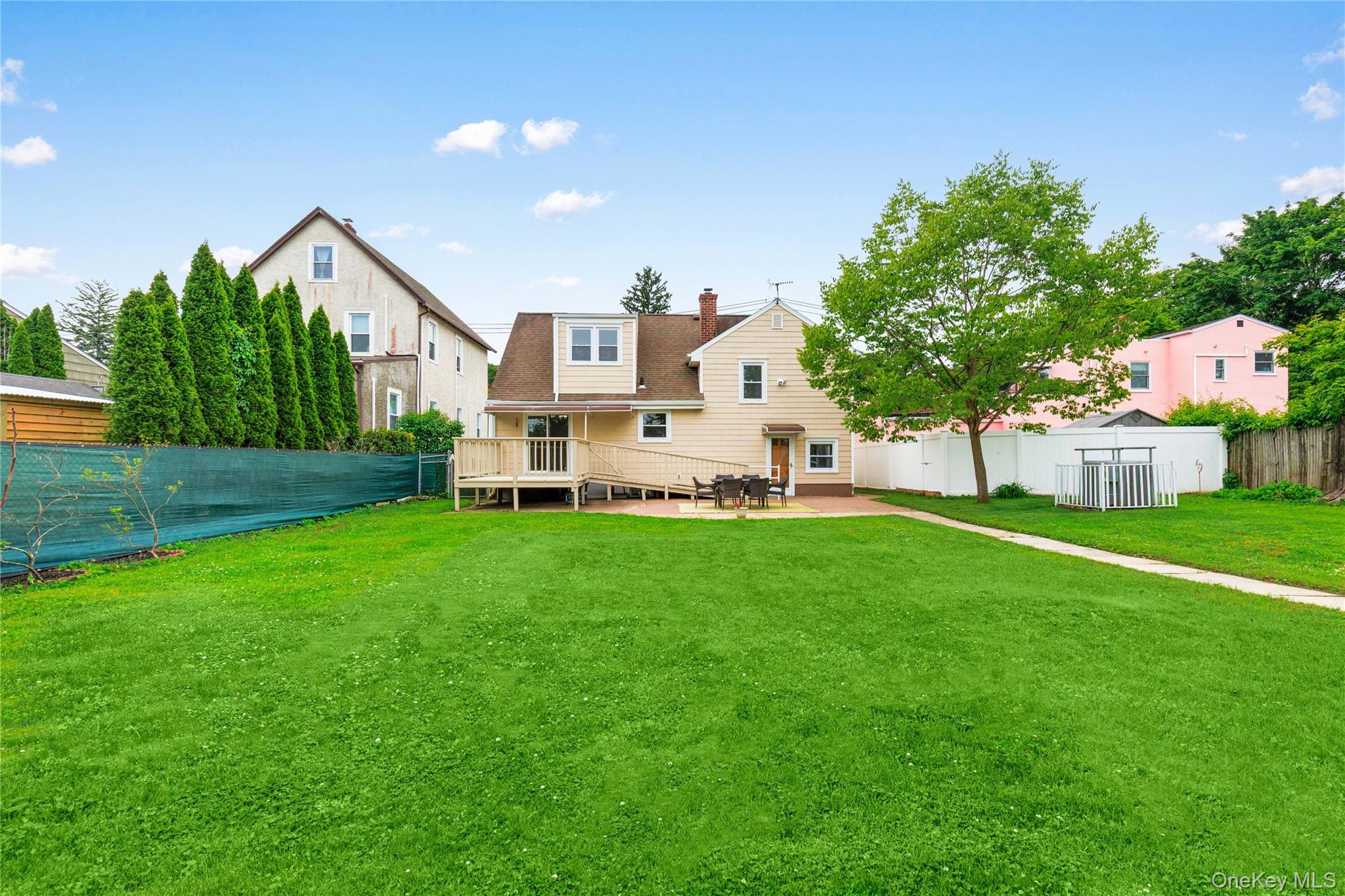 46 Mathews Street Harrison, NY 10528 - Photo 23 of 30 a view of a house with a yard and sitting area