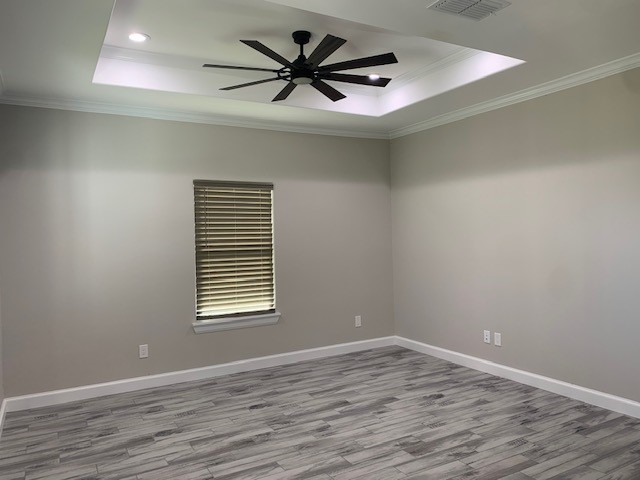 592 West Garrett Street Robstown, TX 78380 - Photo 4 of 15 wooden floor in an empty room with a window