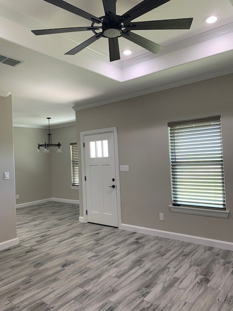 592 West Garrett Street Robstown, TX 78380 - Photo 5 of 15 a view of an empty room and window and wooden floor