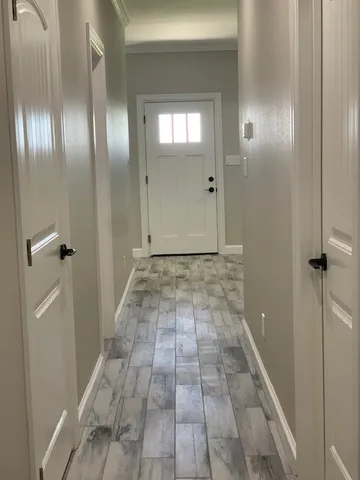 a view of a hallway with an empty room