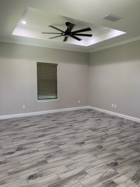 592 West Garrett Street Robstown, TX 78380 - Photo 10 of 15 a view of a livingroom with wooden floor and a ceiling fan
