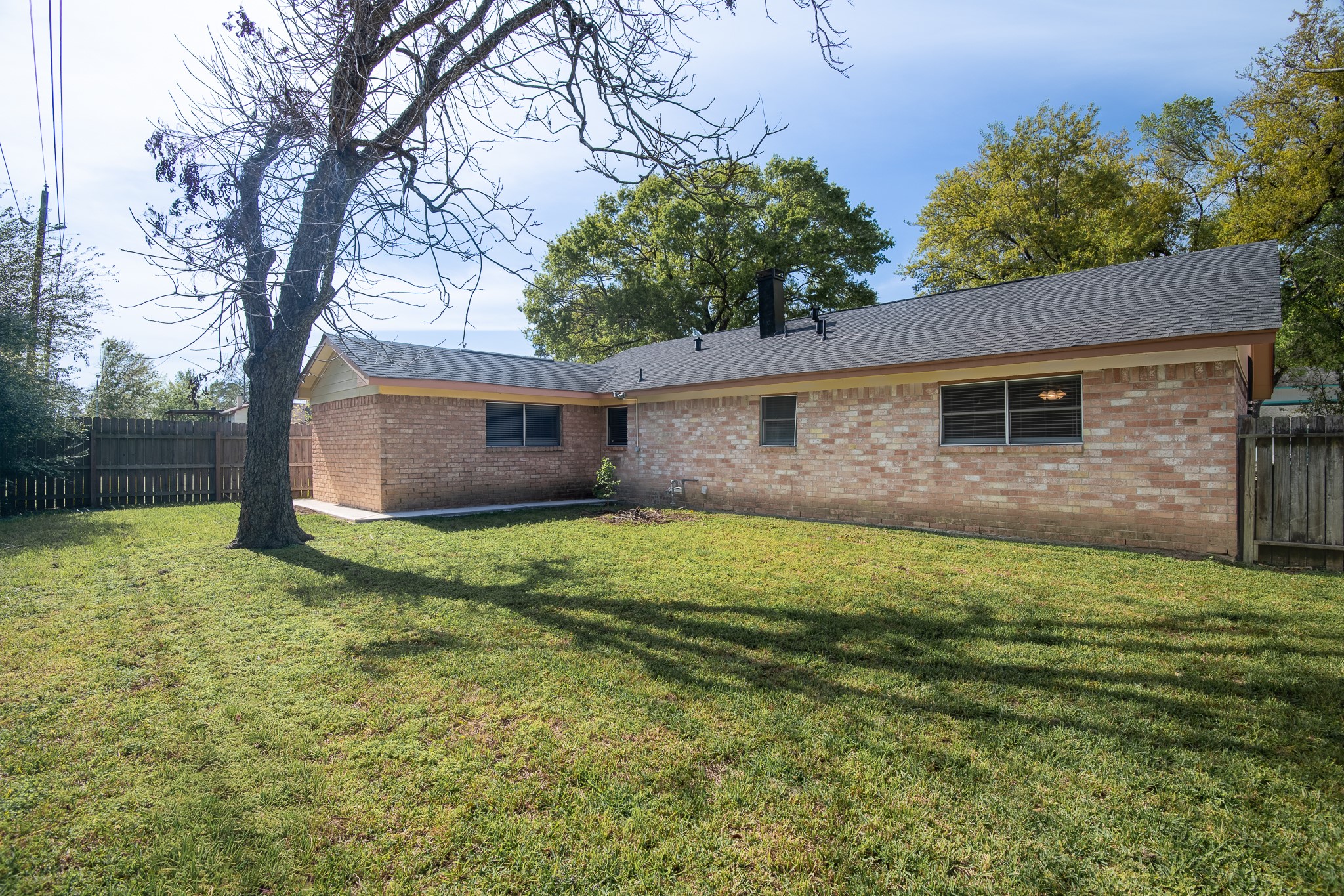 2510 Marble Falls Drive Spring, TX 77373 - Photo 21 of 26 a backyard of a house with lots of green space