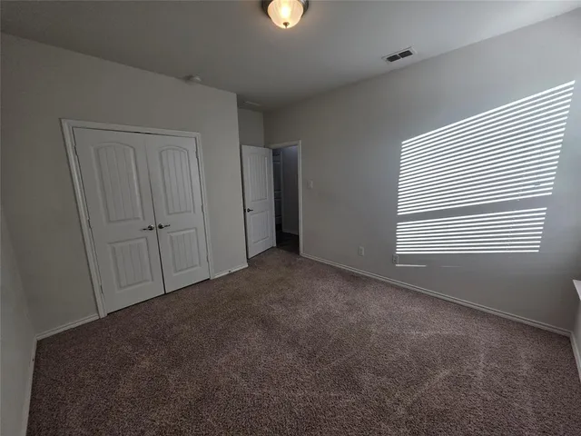 a view of empty room with windows