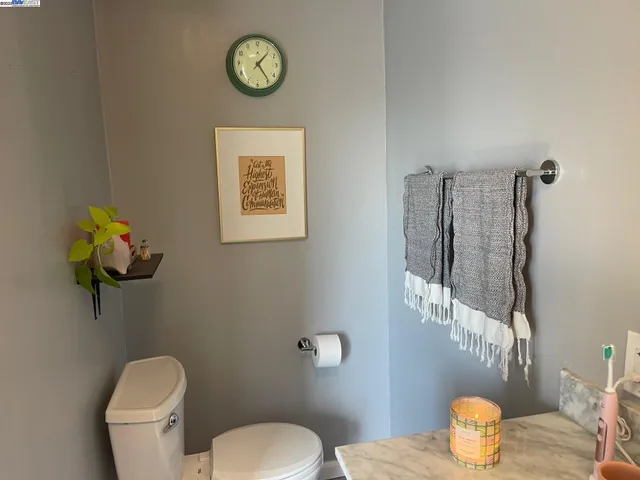 a bathroom with a toilet and a sink