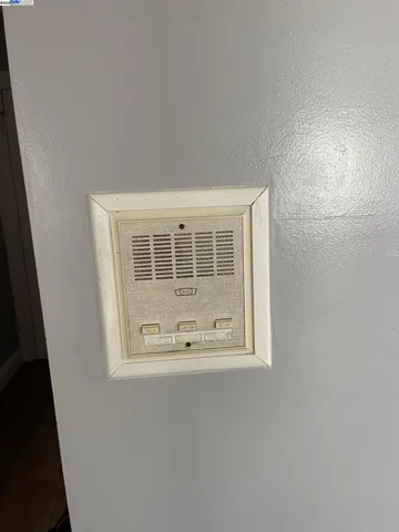 a view of a car park in front of brick building