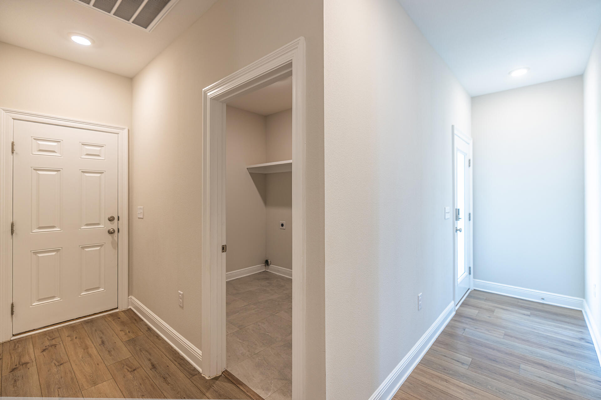 8959 Eureka Street Milton, FL 32583 - Photo 12 of 37 a view of a hallway with wooden floor