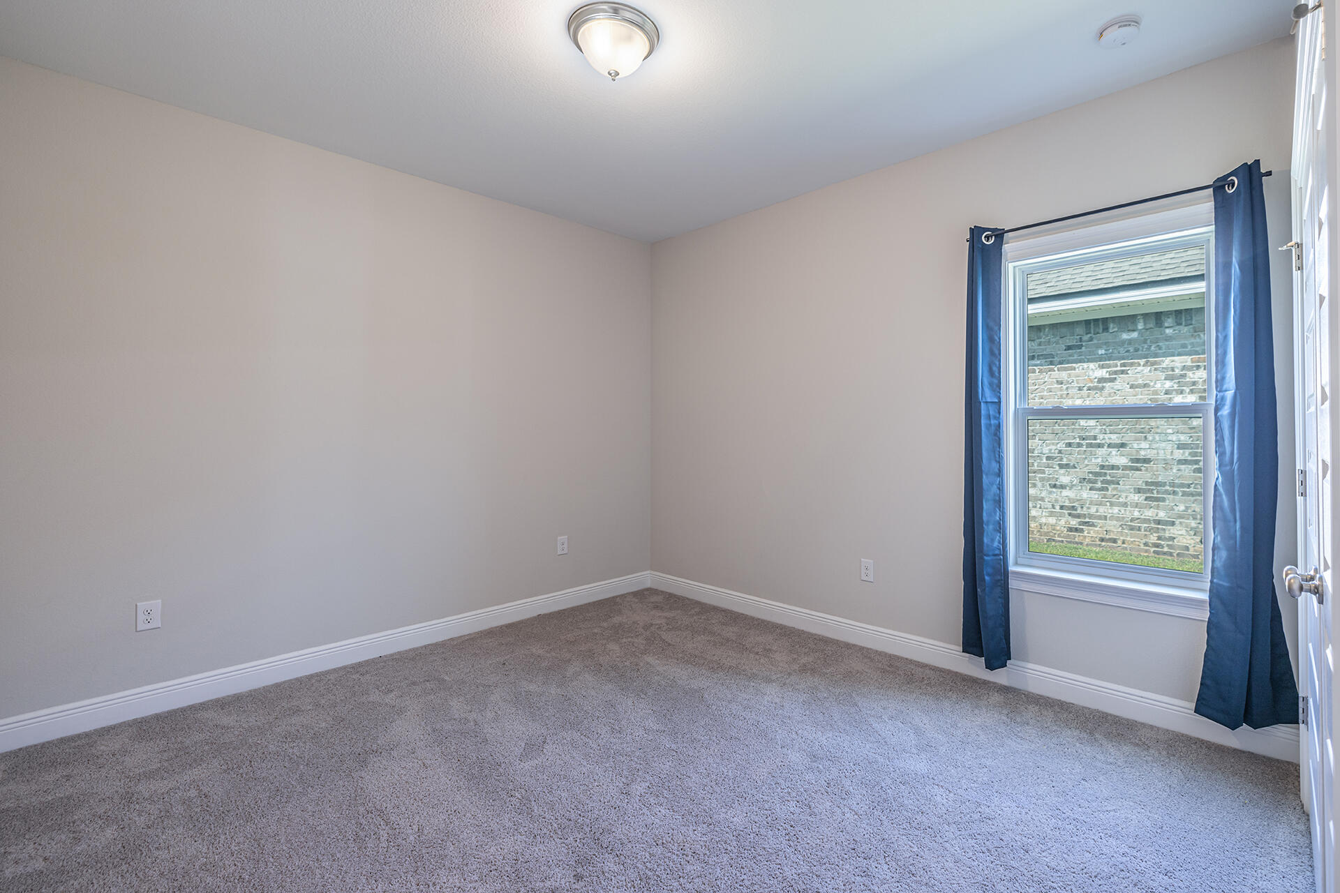 8959 Eureka Street Milton, FL 32583 - Photo 27 of 37 an empty room with a window