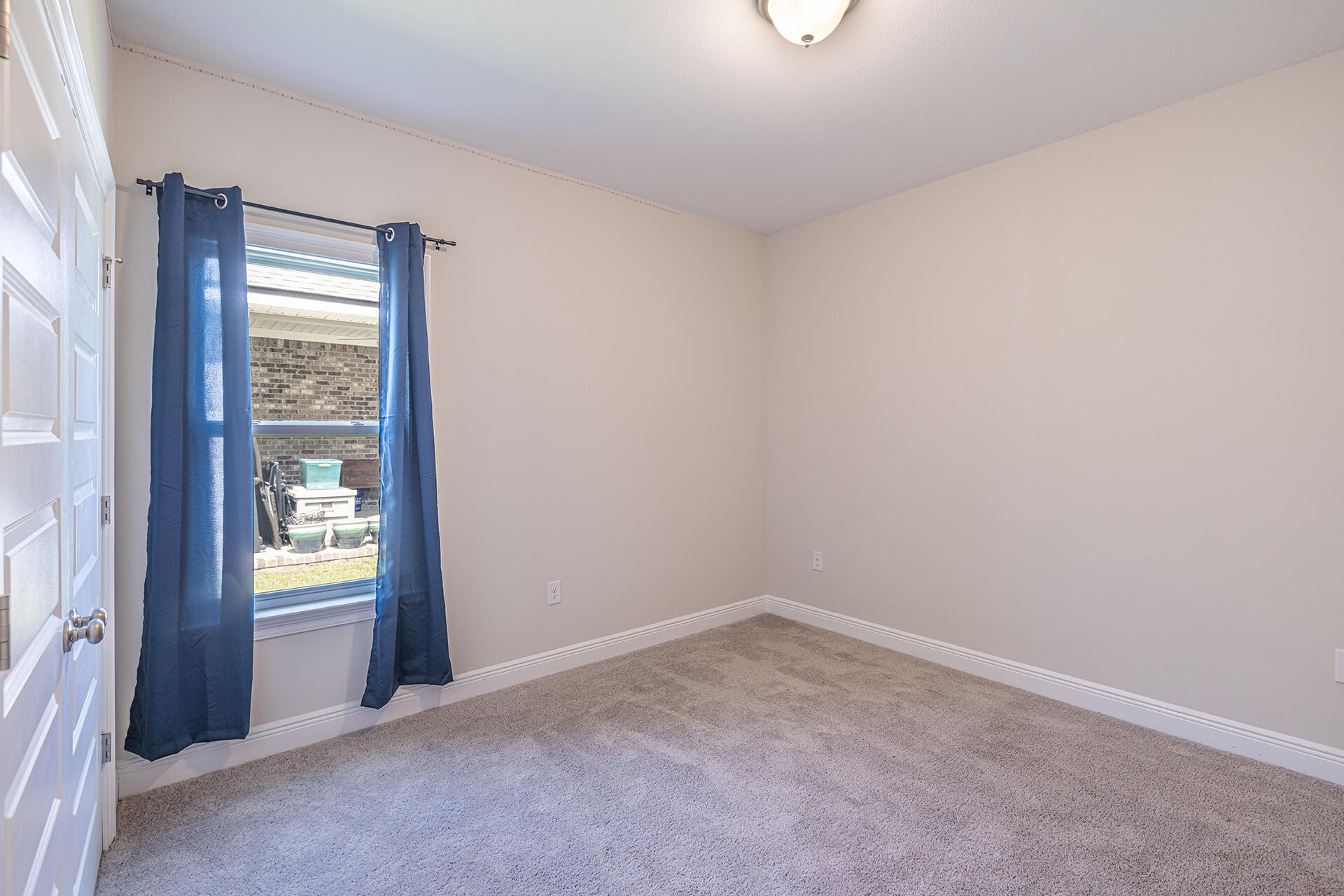 8959 Eureka Street Milton, FL 32583 - Photo 29 of 37 a view of an empty room with a window