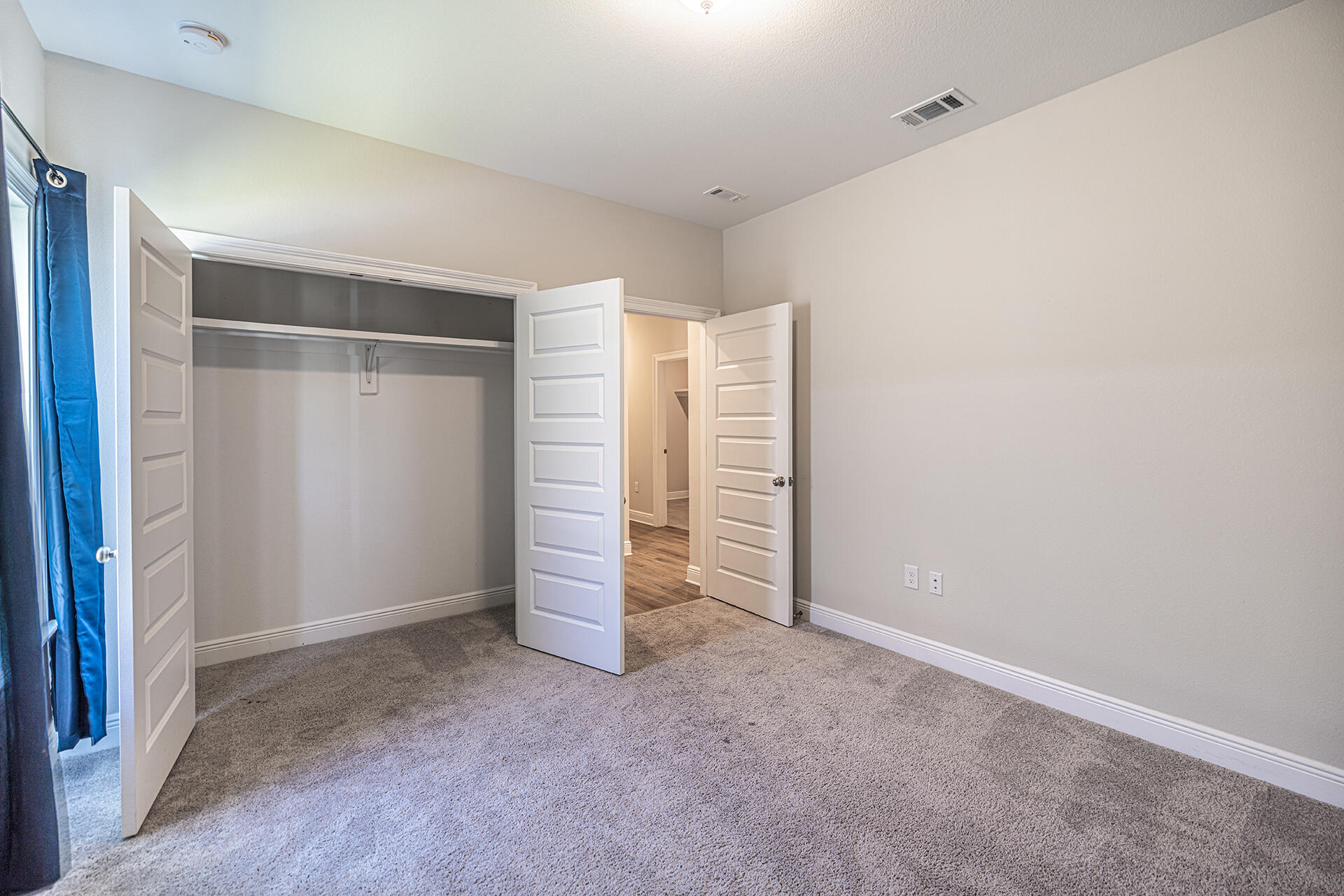 8959 Eureka Street Milton, FL 32583 - Photo 30 of 37 an empty room with closet and fan