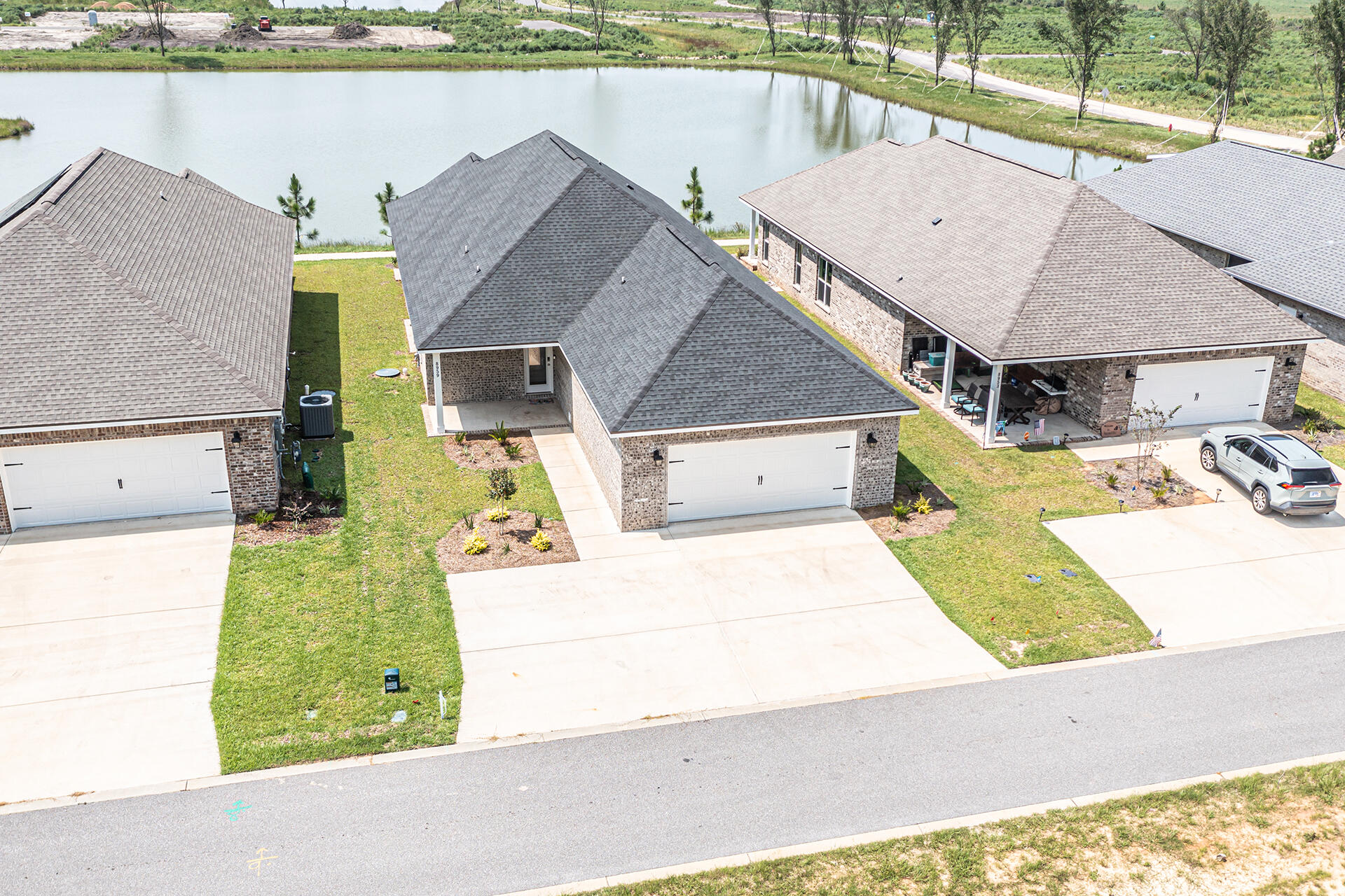8959 Eureka Street Milton, FL 32583 - Photo 3 of 37 a aerial view of a house with a swimming pool
