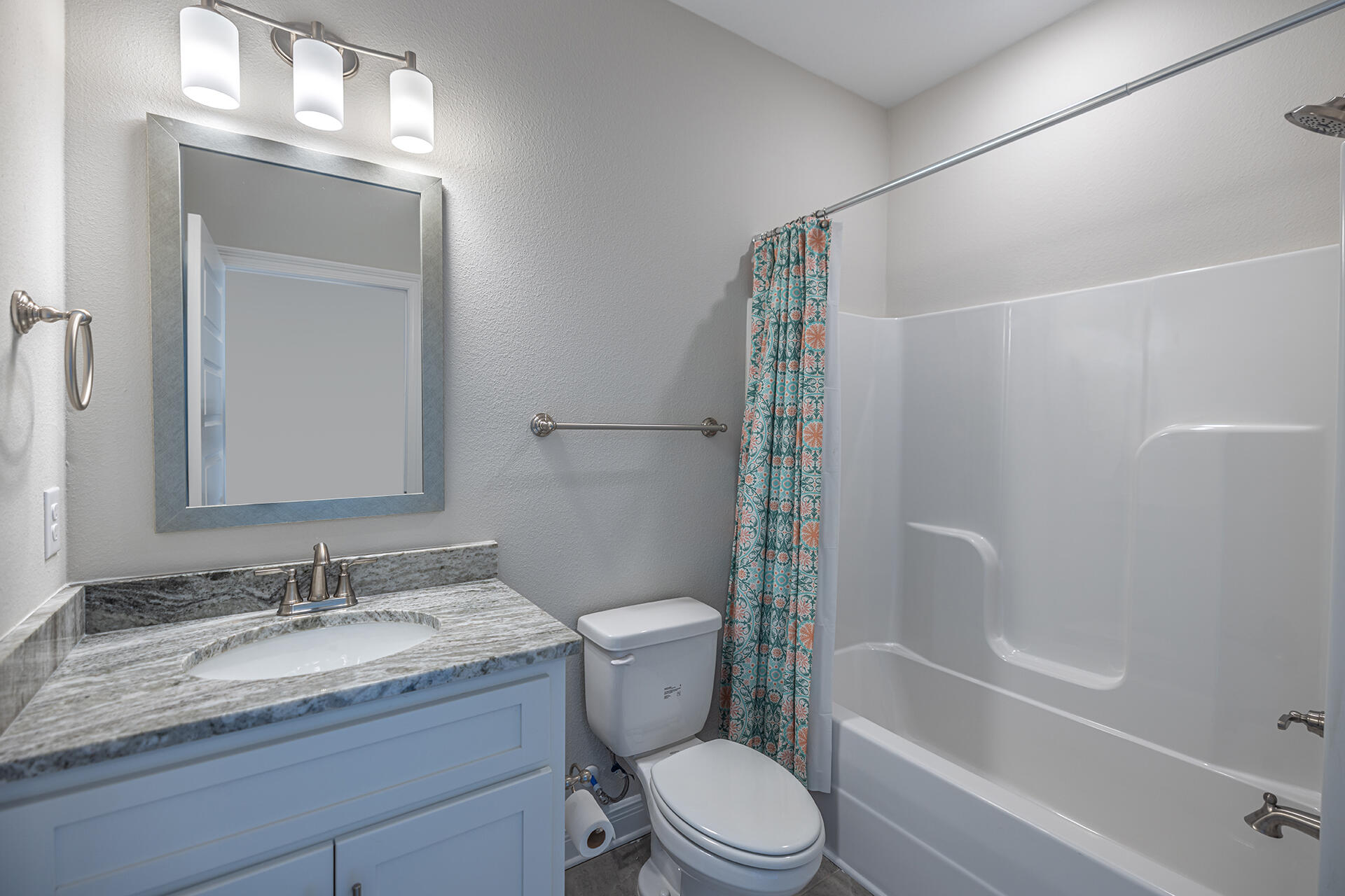 8959 Eureka Street Milton, FL 32583 - Photo 31 of 37 a bathroom with a granite countertop sink toilet and shower