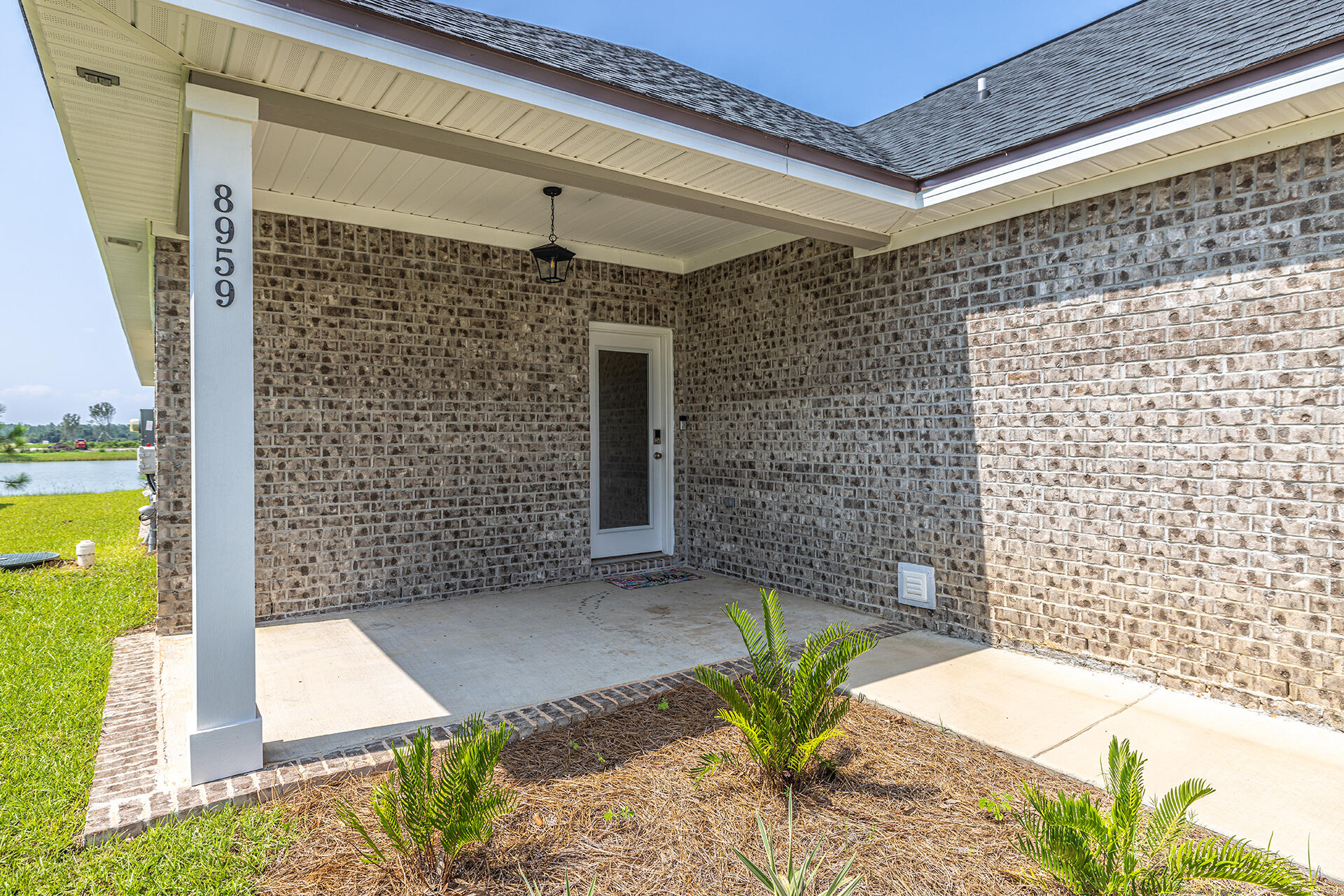 8959 Eureka Street Milton, FL 32583 - Photo 10 of 37 a view of a patio with table and chairs and potted plants