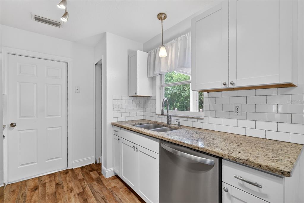 36 Bay Ridge Loop Mascotte, FL 34753 - Photo 12 of 32 a kitchen with a sink and cabinets