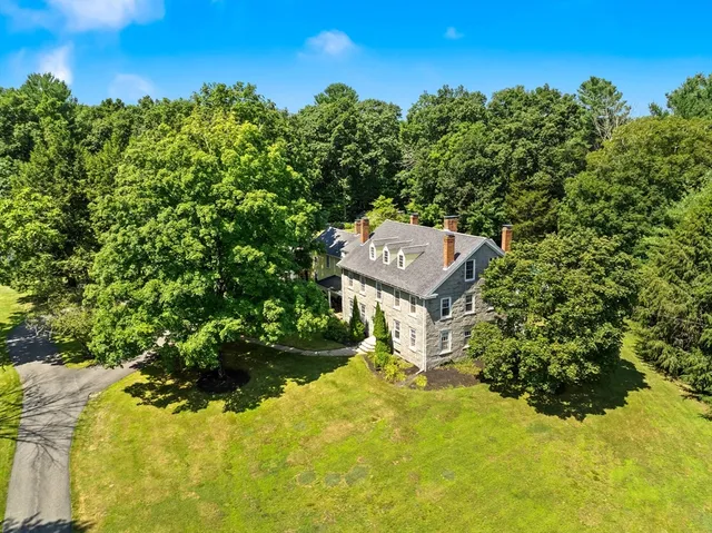 a view of a yard with a tree
