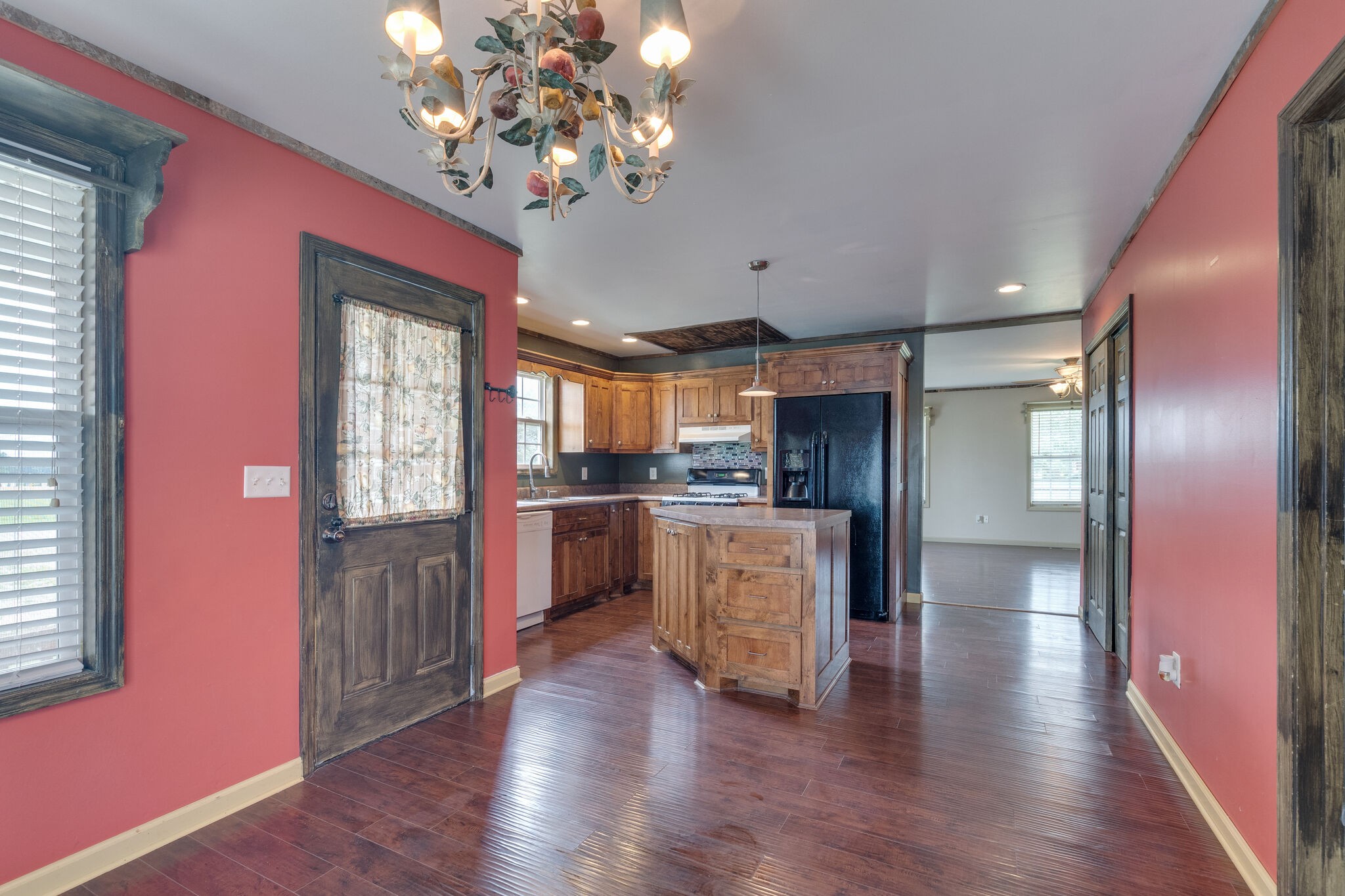 482 Rabbit Trail Road Leoma, TN 38468 - Photo 16 of 33 a view of a hallway with wooden floor and a kitchen