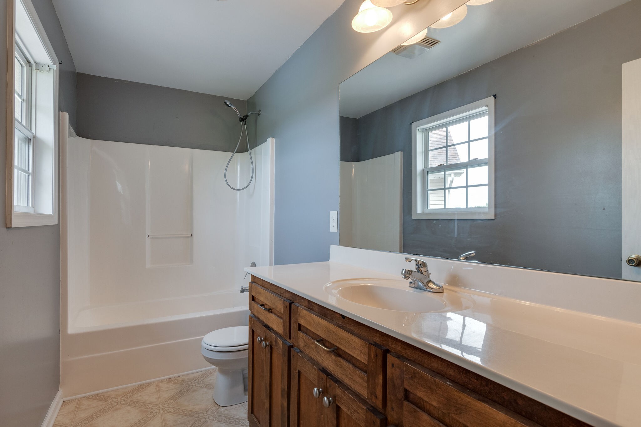 482 Rabbit Trail Road Leoma, TN 38468 - Photo 18 of 33 a bathroom with a granite countertop sink a toilet and shower