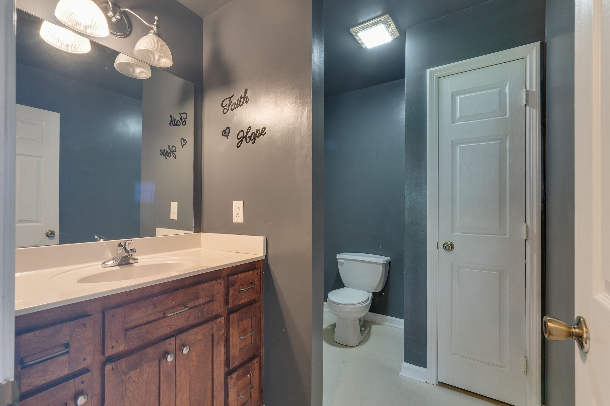 482 Rabbit Trail Road Leoma, TN 38468 - Photo 20 of 33 a bathroom with a toilet sink and mirror