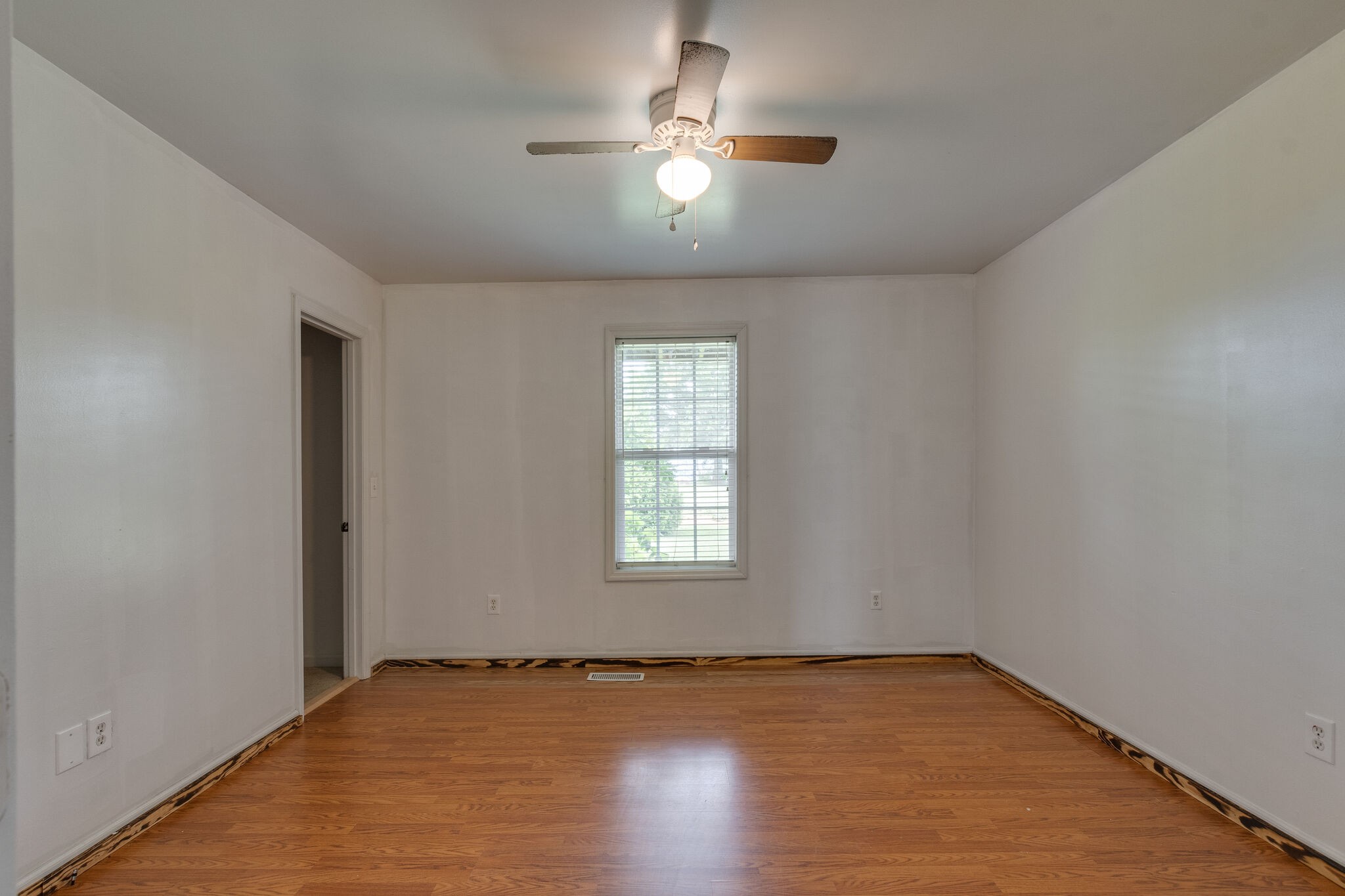 482 Rabbit Trail Road Leoma, TN 38468 - Photo 21 of 33 an empty room with window and chandelier fan