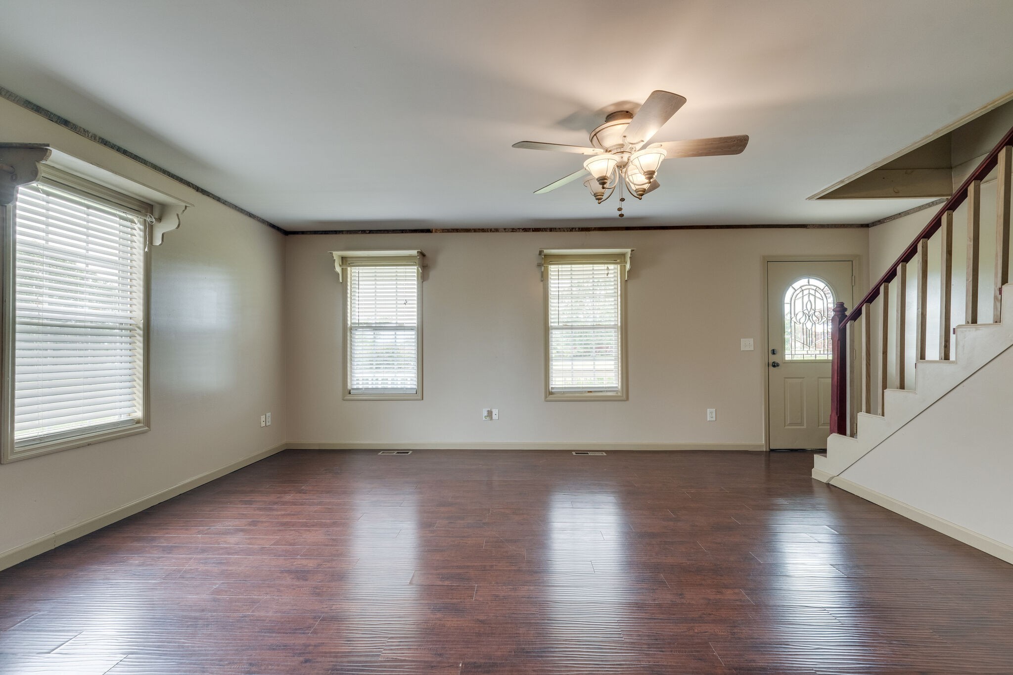 482 Rabbit Trail Road Leoma, TN 38468 - Photo 9 of 33 a view of an empty room with wooden floor and a window