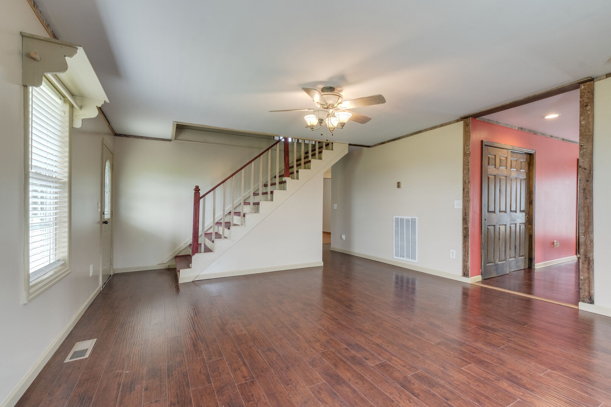 482 Rabbit Trail Road Leoma, TN 38468 - Photo 10 of 33 a view of an empty room with wooden floor and a window