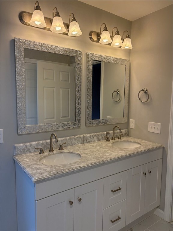 182 Avenue C, Unit S6 Woonsocket, RI 02895 - Photo 9 of 15 Primary bathroom featuring a double-sink vanity and a walk-in shower.