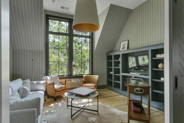 a living room with furniture a window and a fireplace