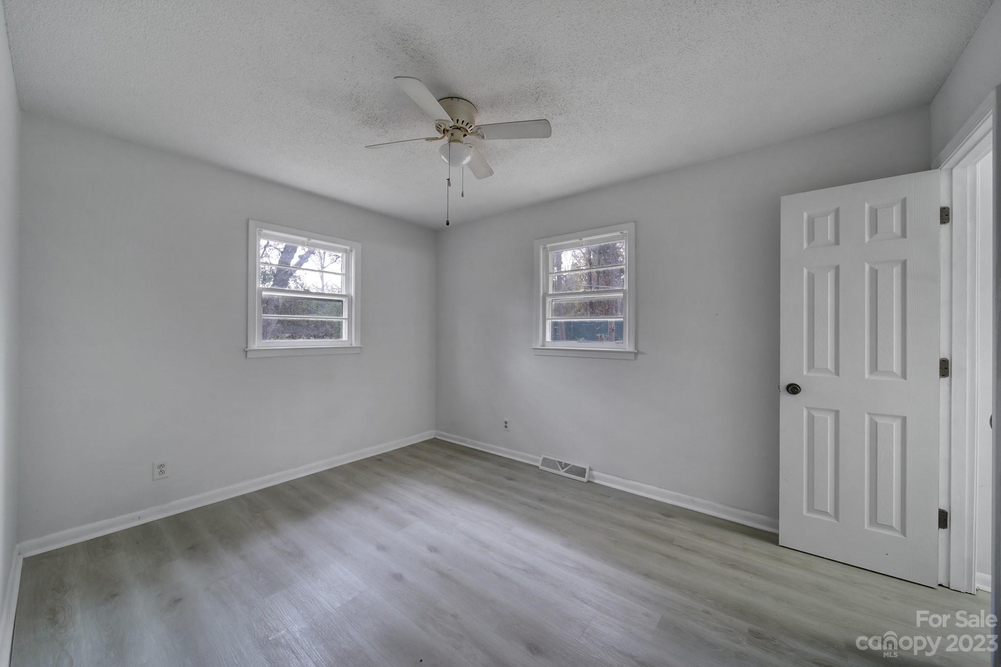 5119 State Rd S-46-557 Clover, SC 29710 - Photo 14 of 26 a view of empty room with wooden floor and fan