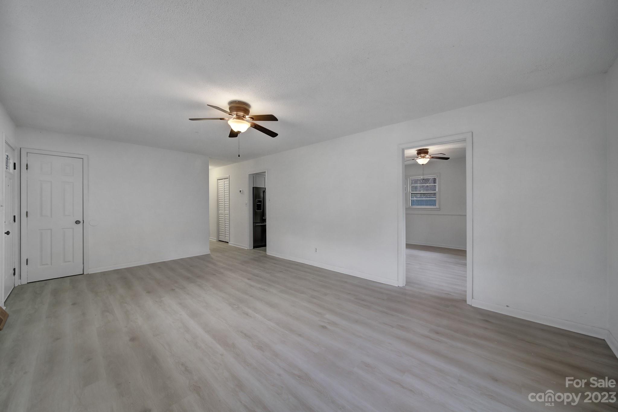 5119 State Rd S-46-557 Clover, SC 29710 - Photo 6 of 26 a view of empty room with wooden floor and fan