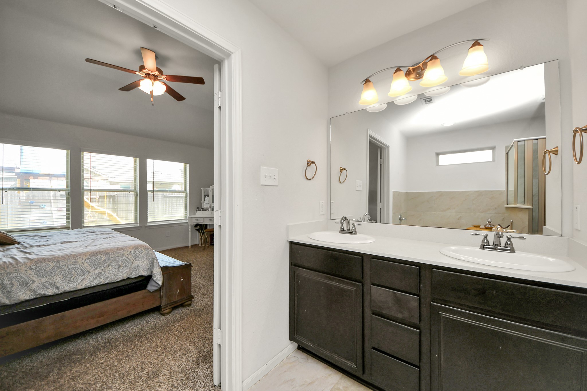 6226 Mason Way Rosenberg, TX 77471 - Photo 18 of 30 a en suite bathroom with a double vanity sink and a mirror