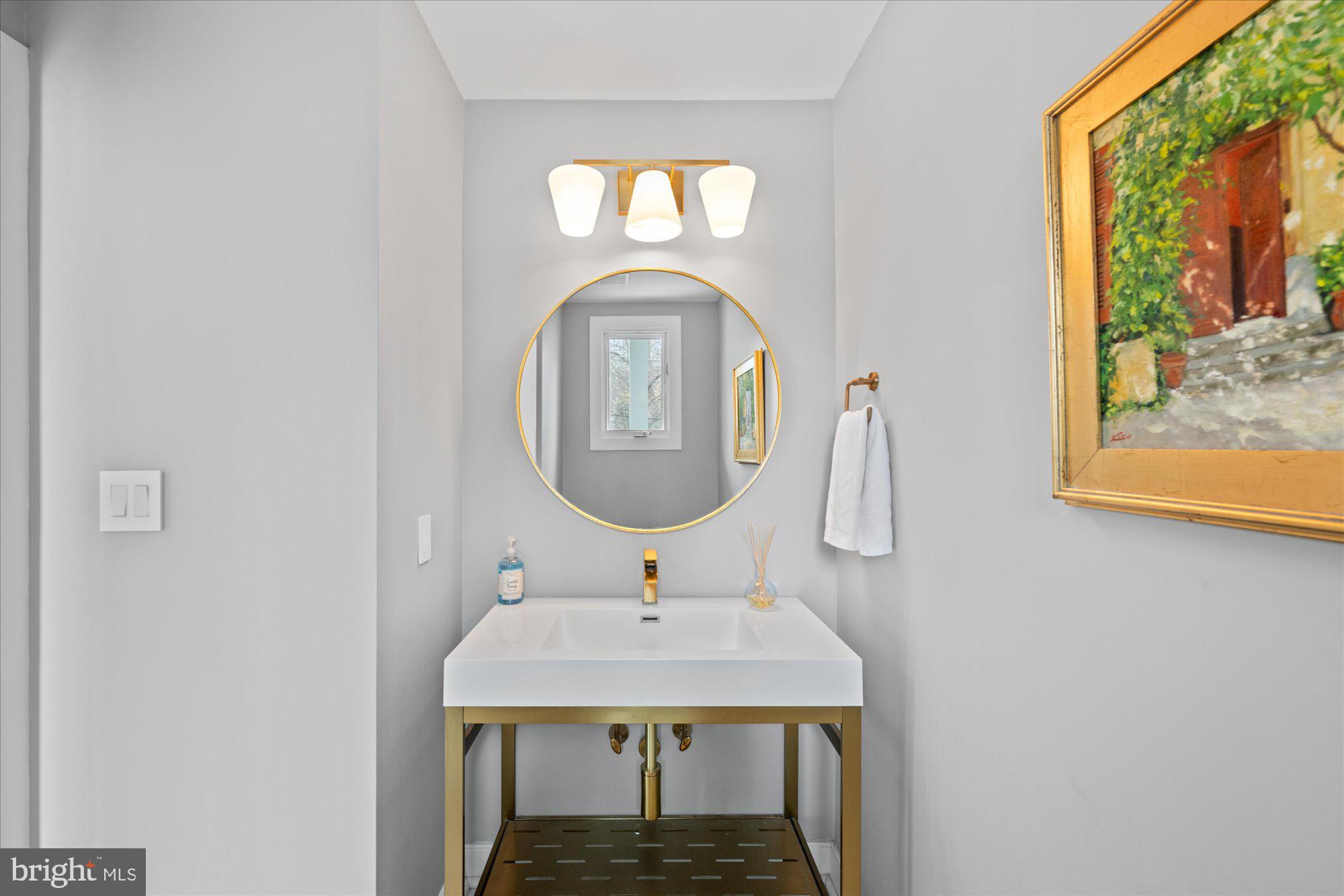 6700 Rannoch Road Bethesda, MD 20817 - Photo 8 of 36 a bathroom with a sink and a mirror