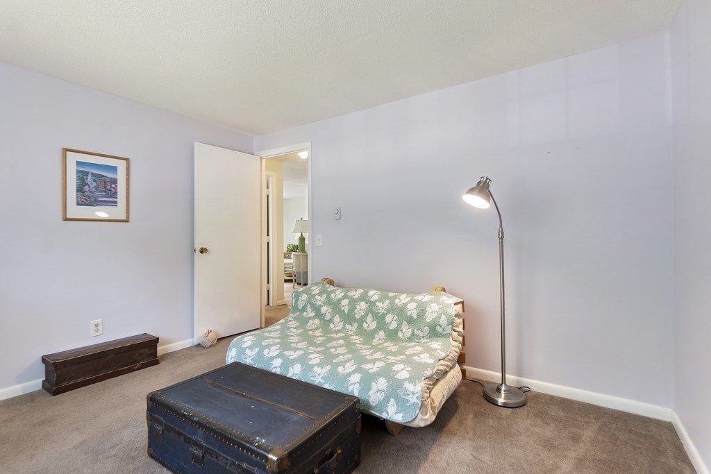 37 Leonard Road, Unit 37 Boxborough, MA 01719 - Photo 12 of 20 a room with a bed and a night stand