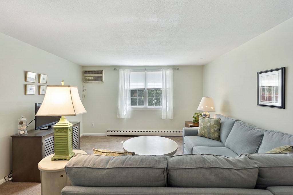 37 Leonard Road, Unit 37 Boxborough, MA 01719 - Photo 6 of 20 a living room with furniture and a window