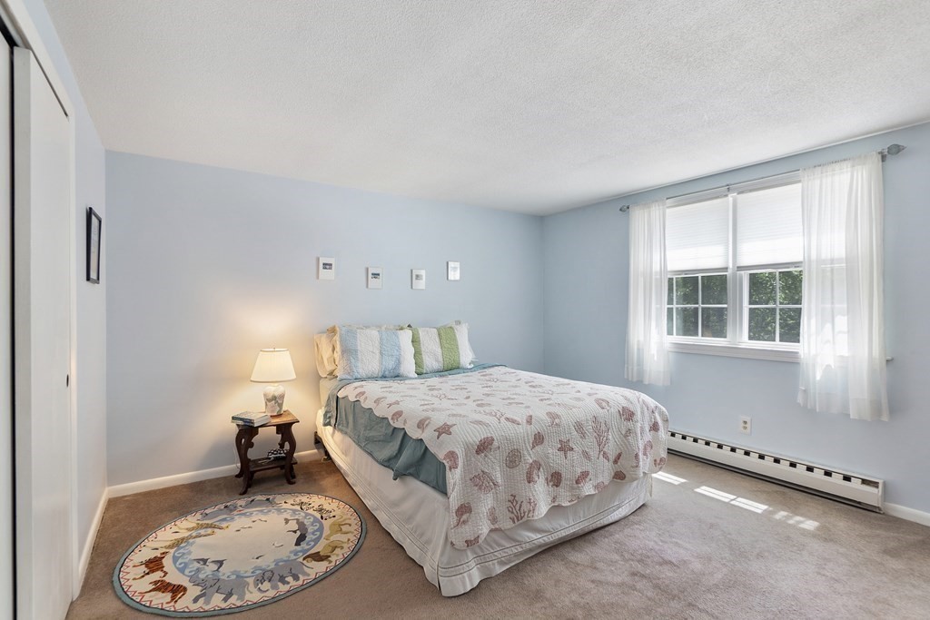 37 Leonard Road, Unit 37 Boxborough, MA 01719 - Photo 9 of 20 a bedroom with a bed and a window