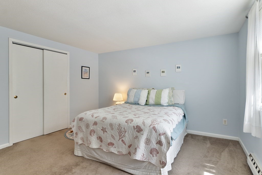 37 Leonard Road, Unit 37 Boxborough, MA 01719 - Photo 10 of 20 a bedroom with a bed and a window
